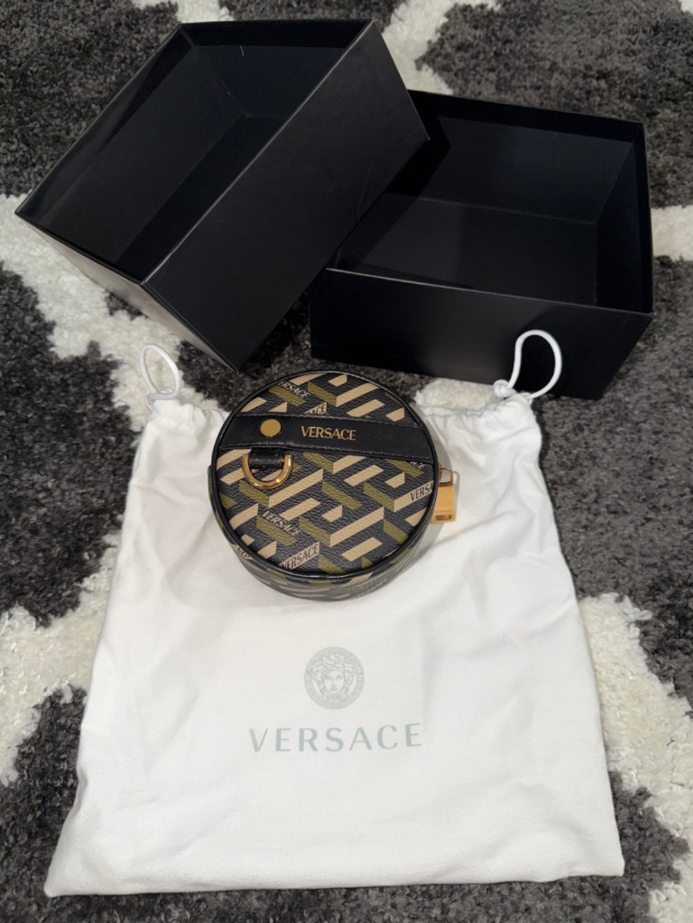 Versace Black and Gold Round Logo Case.